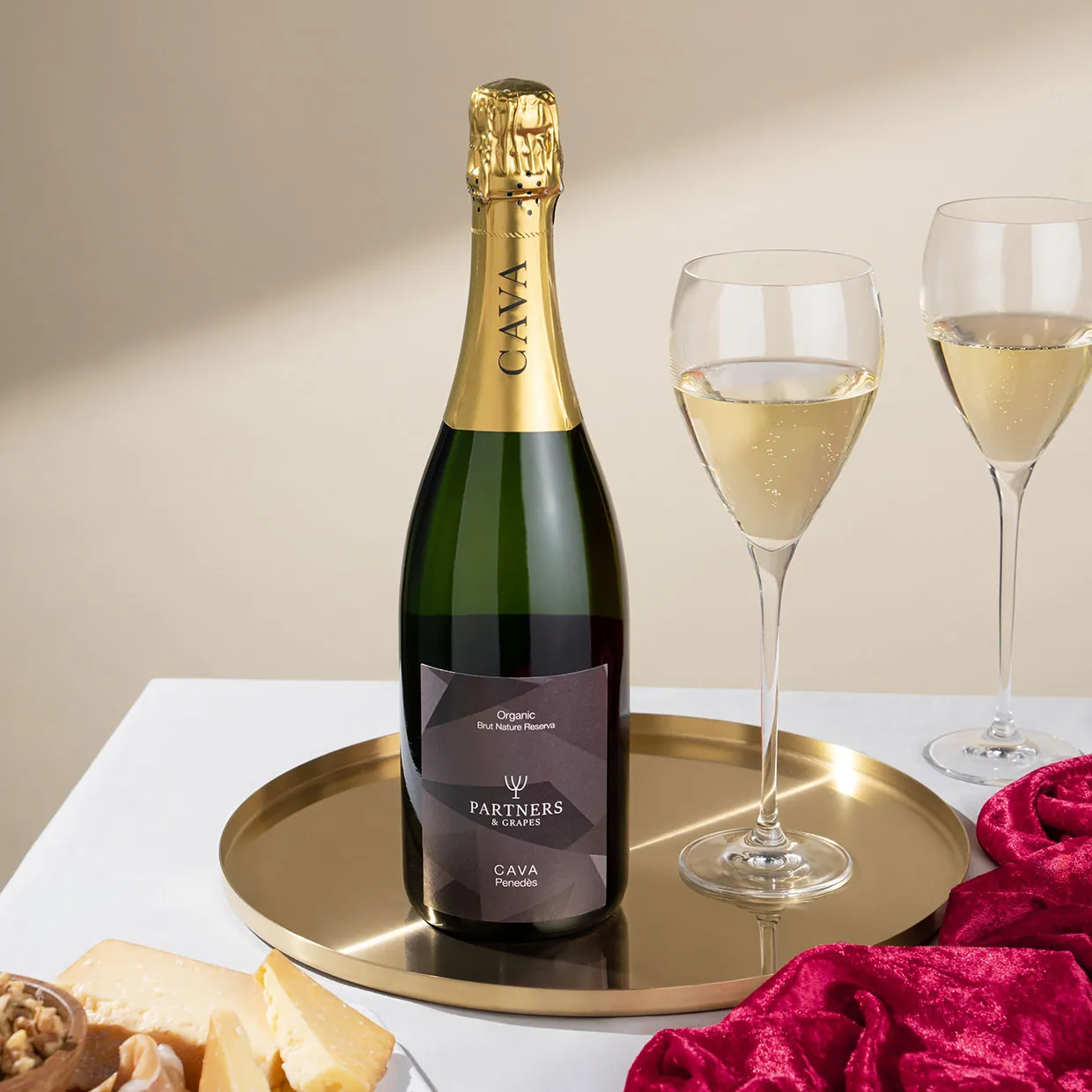 Partners and Grapes Cava wine bottle, a sparkling wine made from Macabeo, Parellada, and Xarel-lo grapes, USDA Organic and vegan-certified, with delicate bubbles and notes of apples, pears, and aging yeast.